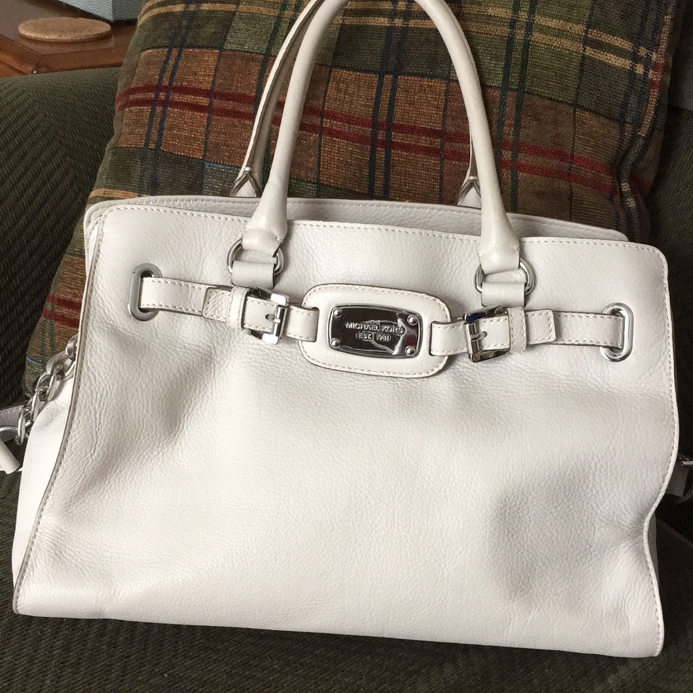 Woman’s Michael Kors satchel handbag